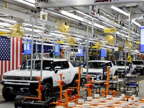 FILE PHOTO: Hummer EV are seen on the production line as U.S. President Joe Biden tours the General Motors 'Factory ZERO' electric vehicle assembly plant, in Detroit, Michigan, U.S. November 17, 2021.