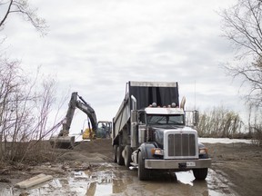Leamington's Hillman Marsh faces further ecological upset An excavator pushes around sand delivered by a dump truck at Hillman Marsh Beach, Wednesday, May 8, 2019. High lake levels have eroded much of the beach.