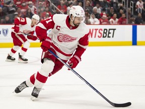 Detroit, Michigan, USA; Detroit Red Wings center Dylan Larkin (71) skates with the puck during the third period against the New Jersey Devils at Little Caesars Arena on Dec 18, 2021.