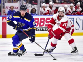 St. Louis Blues right wing Pavel Buchnevich controls the puck as Detroit Red Wings center Dylan Larkin defends second period at Enterprise Center.