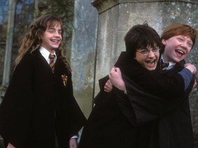 From left to right: EMMA WATSON (Hermione Granger), DANIEL RADCLIFFE (Harry Potter) and RUPERT GRINT (Ron Weasley) in Warner Bros. Pictures' family adventure film Harry Potter and the Chamber of Secrets.