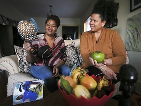 Clarese Carter, left, and Christie Nelson from the Family Fuse organization are shown on Monday, December 13, 2021 with items that will be used to celebrate the upcoming Kwanzaa.