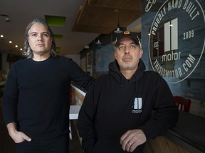 Gino Gesuale, left, and Jay Souilliere, co-owners of Motorburger, are pictured at their recently closed Erie Street location, on Thursday, Dec. 16, 2021.