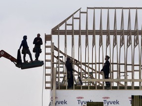 Local jobless rate improved in November. In this Nov. 4. 2021, file photo, workers are shown at the construction site of a new house near the WFCU Centre in Windsor.