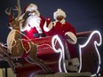 Ho! Ho! Ho! Santa Claus and Mrs. Claus wave at cars passing by during last year's Windsor Santa Claus Parade, presented in a drive-thru format at St. Clair College on Dec. 6, 2020.