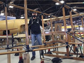 Don Christopher, president of the Canadian Aviation Museum in Windsor is shown next to the Silver Dart project on Wednesday, December 22, 2021. A group of aviation enthusiasts are building a replica of the primitive aircraft.