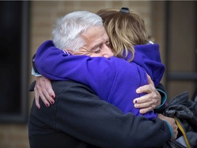 Autumn Taggart's parents, John Taggart and Jolayne Lausch, embrace outside Superior Court Wednesday, Dec. 1, 2021, after a jury found Jitesh Bhogal guilty of first-degree murder of their daughter.