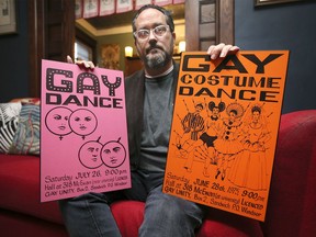 Walter Cassidy poses with posters from the mid 70's promoting Gay Dance events in the city of Windsor. The Windsor Star refused to publish them in the newspaper.