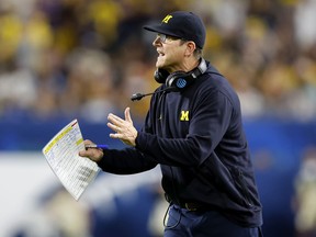 Head Coach Jim Harbaugh of the Michigan Wolverines reacts on the sidelines in the third quarter of the game against the Georgia Bulldogs in the Capital One Orange Bowl for the College Football Playoff semifinal game at Hard Rock Stadium on December 31, 2021 in Miami Gardens, Florida.