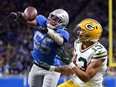 Allen Lazard of the Green Bay Packers catches a touchdown pass during the second quarter against the Detroit Lions at Ford Field on January 09, 2022 in Detroit, Michigan.