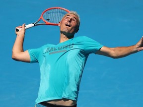 Bernard Tomic of Australia serves during a practice session ahead of the 2022 Australian Open at Melbourne Park on January 10, 2022 in Melbourne, Australia.