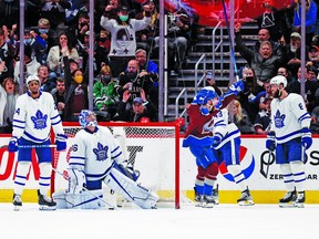 Avalanche left winger J.T. Compher (37) celebrates after scoring the tying goal against Toronto Maple Leafs goaltender Jack Campbell as Wayne Simmonds (24), Kyle Clifford (43) and Jake Muzzin look on in the third period at Ball Arena on Saturday.