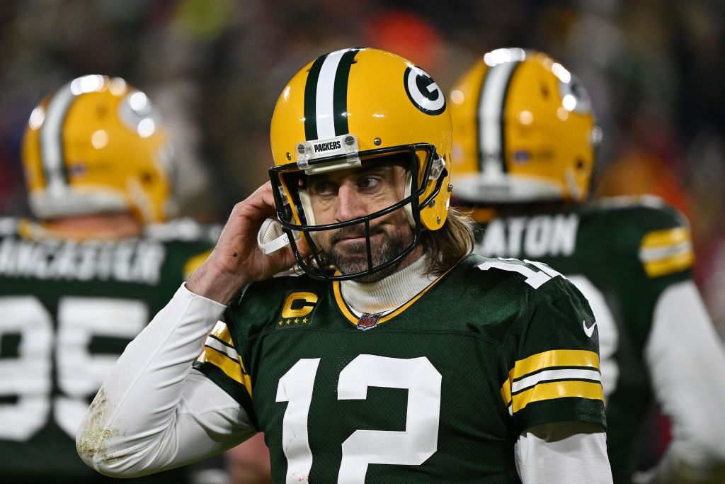 Quarterback Aaron Rodgers #12 of the Green Bay Packers reacts after failing to get a first down during the 2nd quarter of the NFC Divisional Playoff game against the San Francisco 49ers at Lambeau Field on January 22, 2022 in Green Bay, Wisconsin. (Photo by Quinn Harris/Getty Images)