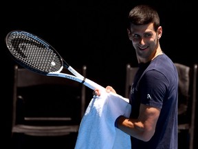 Novak Djokovic of Serbia smiles during a practice session ahead of the Australian Open at the Melbourne Park tennis centre in Melbourne on Jan. 12, 2022.