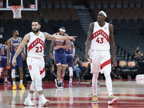 Toronto Raptors forward Pascal Siakam (43) and guard Fred VanVleet (23) react to a call during the fourth quarter against the Phoenix Suns at Scotiabank Arena.