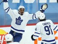 Toronto Maple Leafs forward Wayne Simmonds (left) celebrates with teammate John Tavares after scoring a goal.
