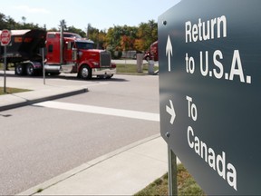 A truck leaves the Canada-United States border crossing at the Thousand Islands Bridge in Lansdowne, Ont., Sept. 28, 2020.