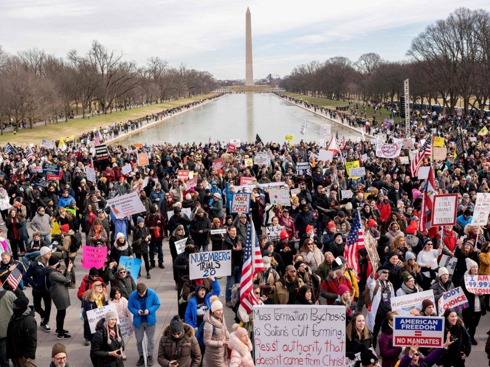 Demonstrators participate in a Defeat the Mandates march in Washington, D.C., Sunday, Jan. 23, 2022.
