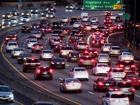 (FILES) In this file photo taken on September 17, 2019, vehicles drive on the 101 freeway in Los Angeles, California. - The US announced on December 20, 2021, it will increase standards for emissions from cars and trucks and implement the new rules over three years from 2023, in Washington's latest bid to fight climate change.