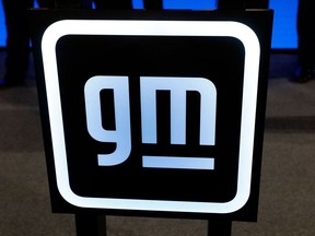 A General Motors sign is seen during an event on January 25, 2022 in Lansing, Michigan. - This investment will create 4,000 new jobs and retaining 1,000, and significantly increasing battery cell and electric truck manufacturing capacity. This is the single largest investment announcement in GM history. The investment includes construction of a new Ultium Cells battery cell plant in Lansing and the conversion of GMÕs assembly plant in Orion Township, Michigan for production of the Chevrolet Silverado EV and the electric GMC Sierra, GM's second assembly plant scheduled to build full-size electric pickups.