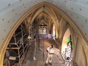 Ray Lytle continues his work restoring the paint on the ceiling of Assumption Church on Friday, Oct. 1, 2021.