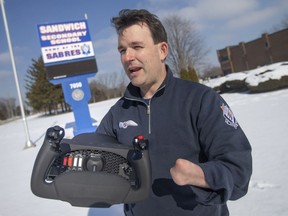 Sandwich High School teacher Rob Jasey is pictured with a honeycomb flight yoke used to teach basic flight maneuvers for a new aviation studies course, Monday January 31, 2022.