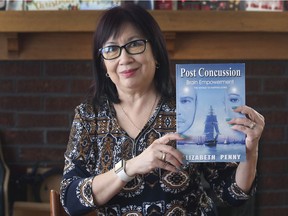Betty Penny has written a book about her experiences recovering from a brain injury sustained in a 2014 car crash. She is shown at her Windsor home on Jan. 3, 2022.