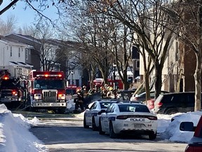 Firefighters at the scene of a triple fatal blaze in Brampton on Thursday, Jan. 20, 2022.