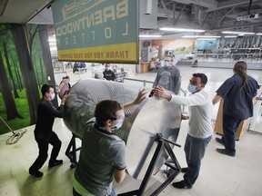 Volunteers spin the large ticket barrel at the Brentwood Recovery Home on Saturday, Jan. 15, 2022, during the organization's 30th annual dream home lottery draw.