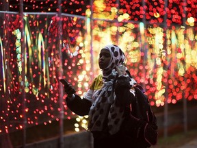 A young lady enjoys the sights at the Bright Lights Windsor display at the Jackson Park on Thursday, December 2, 2021.