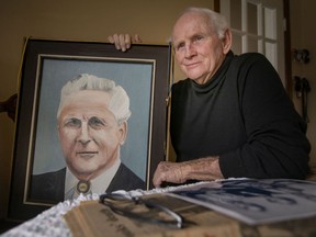 George Brooks, 78, son of the late labour leader, Charlie Brooks, is pictured with a portrait of his father while at his home on the 45th anniversary of his death, on Monday, January 17, 2022.