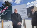 Brook Handysides, left, and CBRE's Brad Collins, pictured in front of a recently sold commercial property on Hawthorne Drive, Tuesday, January 25, 2022.