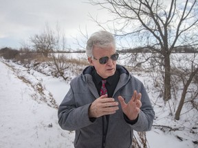 Tim Byrne, CAO of the Essex Region Conservation Authority, explains the importance of an agricultural drainage ditch on Baseline Road where a 1,000-home development is slated to go, on Tuesday, January 25, 2022.