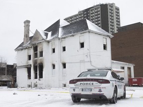 Fire and smoke damage can be seen on a building in the 800 block of Ouellette Avenue, on Sunday, Jan. 2, 2021.