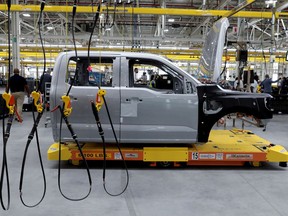 FILE PHOTO: The cab to a Ford all-electric F-150 Lightning truck prototype is seen on an automated guided vehicle (AGV) at the Rouge Electric Vehicle Center in Dearborn, Michigan, U.S. September 16, 2021.
