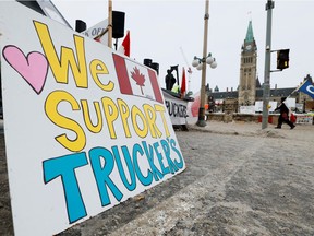 A protest sign is seen on Parliament Hill, as demonstrations by truckers and their supporters against the coronavirus disease (COVID-19) vaccine mandates continue, in Ottawa, Ontario, Canada, January 31, 2022.