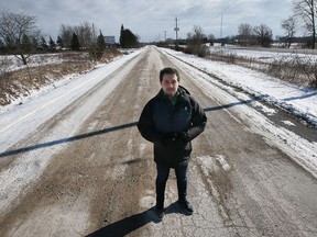 Kingsville Mayor Nelson Santos stands near a section of Highway 3 at Division Road where the Province of Ontario is expropriating land for the long-awaited widening of Highway 3. Photographed Jan. 28, 2022.