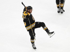 Boston Bruins right wing David Pastrnak (88) celebrates his third goal of the game during the second period against the Philadelphia Flyers at TD Garden in Boston, Jan. 13, 2022.