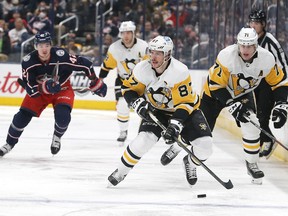 Pittsburgh Penguins center Sidney Crosby (87) carries the puck against the Columbus Blue Jackets during the third period at Nationwide Arena on Jan. 21, 2022.