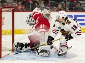 Alex DeBrincat, at left, is seen in action in 2022 against the Detroit Red Wings. He has been rumoured to be a possible trade target for Detroit Red Wings ahead of Wednesday's NHL Draft.