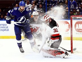 New Jersey Devils goaltender Jon Gillies makes a save against the Tampa Bay Lightning during the first period at Amalie Arena.