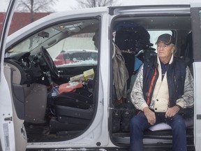 Gilles Bastien, 76, is pictured in his minivan where he currently lives, in a parking lot off Tecumseh Road East, on Monday, January 24, 2022.