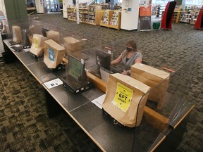 A staff member at the Windsor Public Library Central Branch is shown on Saturday, Jan. 15, 2022. The facility with be open for limited use on Monday, Jan. 17, 2022.