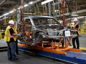 Lordstown Motors associates work on a pre-production all electric pickup truck, the Endurance, at the Lordstown Assembly Plant in Lordstown, Ohio, U.S., June 21, 2021.