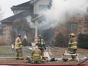 Lakeshore firefighters are shown at the scene of a house fire on Saturday, January 2022 at Russell Woods Drive and Cleophas Drive. The incident occurred at approximately noon.