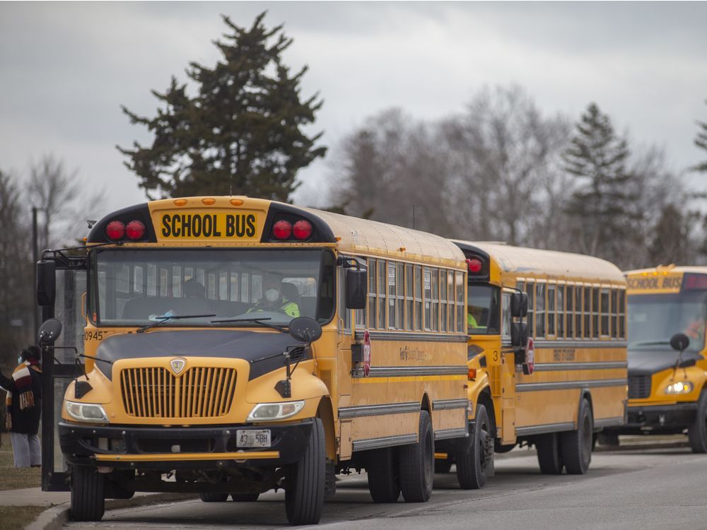 School buses line up outside Glenwood Public School in South Windsor on the first day of in-school learning since mid-December, on Monday, January 17, 2022.
