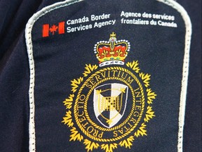 A Canadian Border Services Agency (CBSA) officer's shoulder flash is shown at the Calgary Courts Centre is shown in Calgary, Alta on Saturday April 22, 2017. (Jim Wells//Postmedia Network)