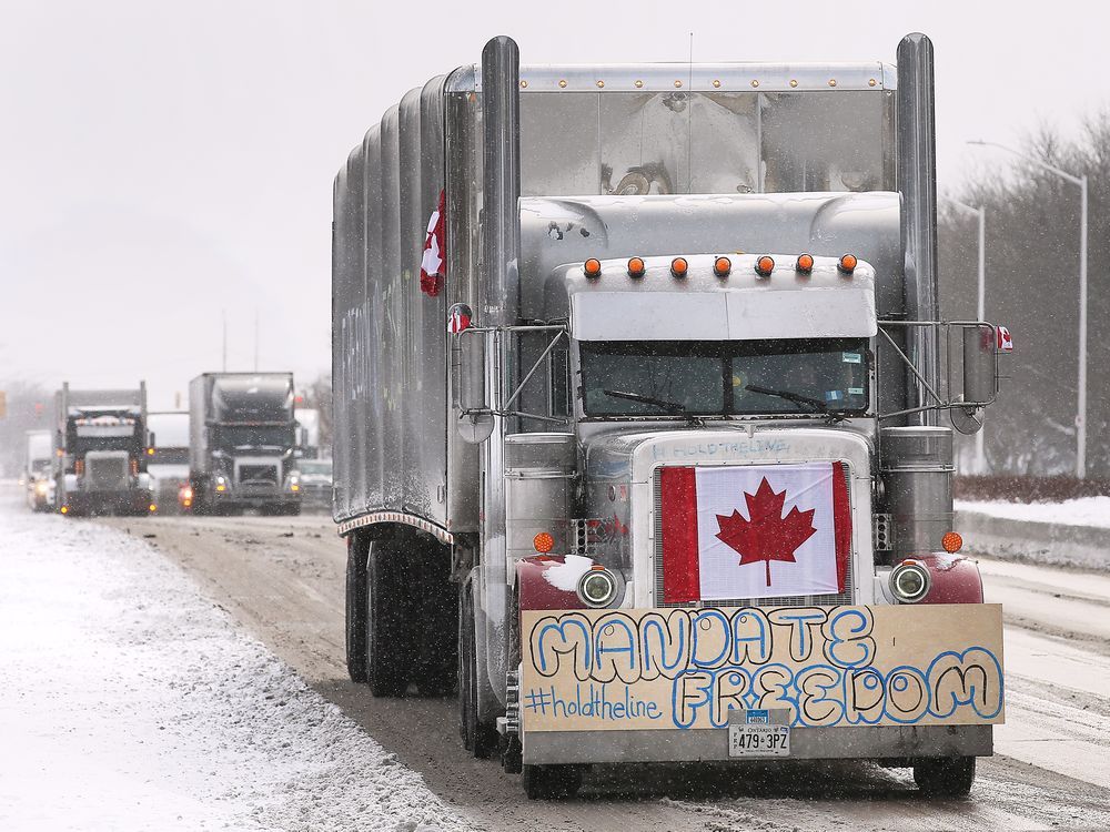 Anti-vaccine-mandate truck convoy loops around near Ambassador Bridge ...