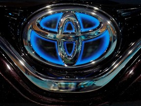 FILE PHOTO: The Toyota logo is seen on the hood of a newly launched Camry Hybrid electric vehicle in New Delhi, India, January 18, 2019.