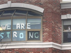 A defiant and hopeful sign is shown at a window at The Village at St. Clair long-term care home in Windsor Jan. 5, 2021.